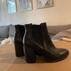 Black faux leather boots with heels